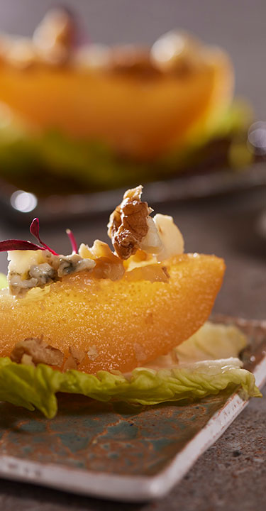 Two canapés in dishes on a table